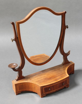 A Hepplewhite style shield shaped dressing table mirror contained in an inlaid mahogany frame with shaped sides fitted a dish, the base fitted a drawer and raised on bracket feet 26 1/2"h x 23"w x 8 1/2"d 