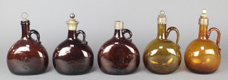 A Continental amber glass bottle with metal mounts 8" and 4 others 