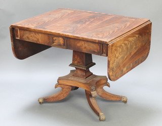 A Georgian mahogany pedestal sofa table with crossbanded top raised on a squared column and triform base with splayed feet, brass paw caps and casters 28" h x 26"d x 35" when closed x 59" when open  