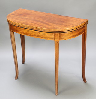A Georgian mahogany crossbanded D shaped card table inlaid satinwood stringing, raised on splayed feet 30"h x 35"w x 17 1/2"d 