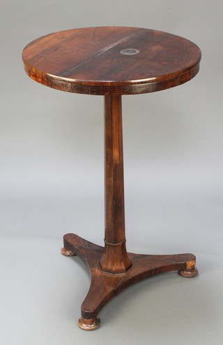 A William IV circular rosewood wine table raised on a chamfered column and triform base 28"h x 18" diam. 

