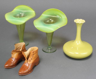 A near pair of vaseline glass vases 7", a pair of Continental bisque boots and a Burmantoft squat vase with elongated neck and wavy rim 7" 