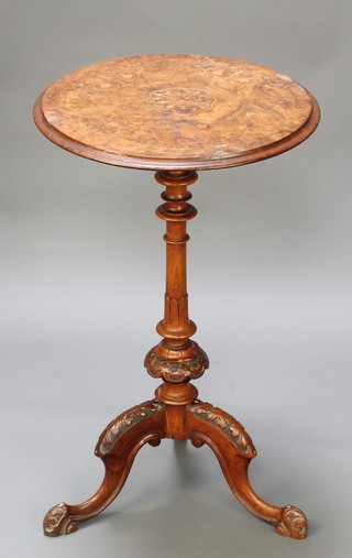 A Victorian inlaid and figured walnut wine table raised on a turned column and tripod base 27 1/2"h x 17" diam. 