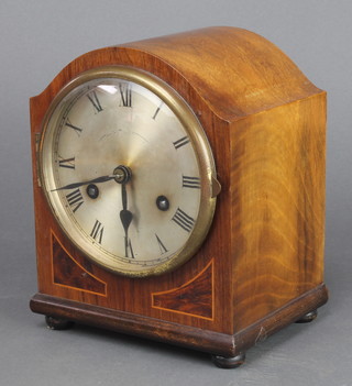 Jahresuhrenfabrik, a  1930's German mantel clock with silvered dial and Roman numerals contained in an arch shaped inlaid mahogany case 