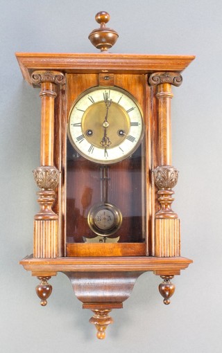 Hamburg American Clock Company.  A Vienna style striking regulator with Roman numerals contained in a walnut case  