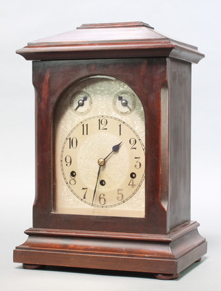 Kienzle, a German chiming bracket clock, back plate marked Made in Germany with 3 sets of serial numbers, having a 6 1/2" silvered dial with chime dial, slow/fast dial and Arabic numerals, contained in a mahogany case