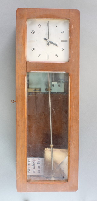 A 1950's Magmeta M50 Master clock with 6 1/2" square silvered dial, Arabic numerals contained in an oak case 
