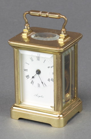 Angelus, a 20th Century carriage timepiece in an enamelled dial contained in a gilt metal place 2 1/2" x 1 1/2" x 1 1/2" 