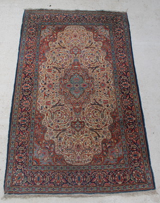A blue ground Persian rug with central medallion 93" x 54" 