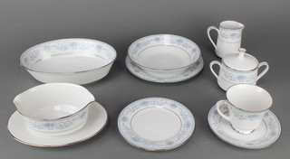 A Noritake Bluehill tea and dinner service comprising 11 tea cups, a cream jug and sugar basin, 12 saucers, 12 small plates, 12 medium plates, 12 dinner plates, 12 dessert bowls, 12 soup bowls, 2 meat plates, 2 oval dishes and a sauce boat 