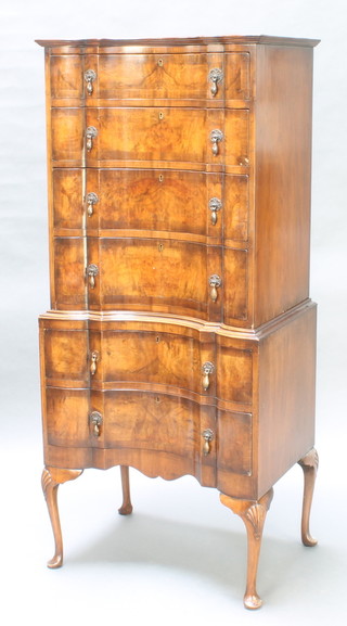 A Queen Anne style concaved figured walnut and crossbanded chest on stand, the upper section with moulded cornice and 4 long drawers, the base with 2 long drawers, raised on cabriole supports 81"h x 26"w x 18 1/2"d 