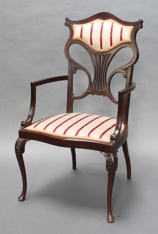 An Edwardian mahogany pierced vase shaped slat back open arm chair with upholstered seat and back, raised on cabriole supports