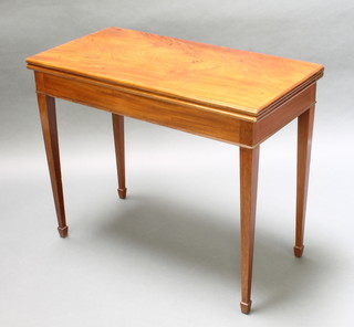 A rectangular Georgian mahogany card table on square tapering supports ending in spade feet 30"h x 36"w x 18"d 