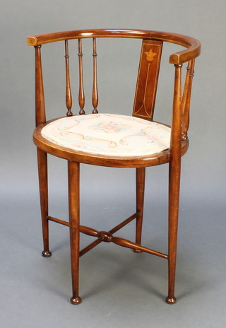 An Edwardian inlaid mahogany tub back chair with oval seat, raised on turned supports with X framed stretcher 