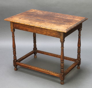 A rectangular Victorian carved oak occasional table with carved apron and box frame stretcher, raised on turned and block supports 26"h x 31 1/2"w x 22"d 