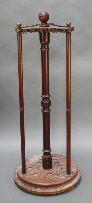 A Victorian mahogany revolving billiard cue rack on turned supports 52"h x 23" diam. 