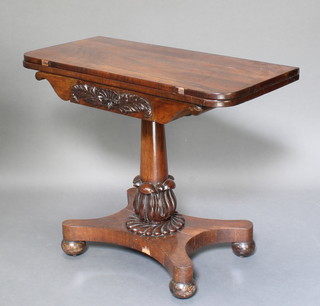 A William IV rosewood D shaped tea table raised on turned column and triform base 29"h x 36"w x 17 1/2"d 