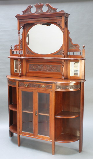 A Victorian carved walnut chiffonier sideboard, the raised mirrored back fitted a shelf, the base fitted 1 long drawer above a cupboard flanked by recesses 86"h x 48"w x 12 1/2" d