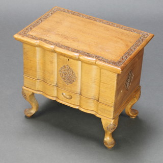 A Burmese rectangular carved light hardwood work table with hinged lid, the base fitted a drawer, raised on cabriole supports 16" x 18" x 12" 