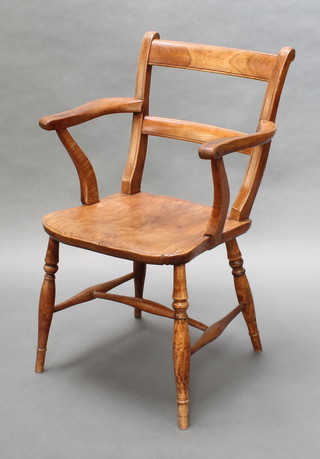 A 19th Century elm Windsor bar back carver chair with solid elm seat, raised on turned supports with H framed stretcher 