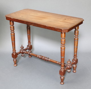 A Victorian rectangular shaped walnut stretcher table, raised on turned supports with H framed stretcher 27"h x 35" x 17" 