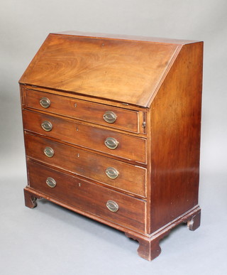 A Georgian mahogany bureau, the fall front revealing a well fitted interior with pigeon holes, cupboard and drawers, above 4 graduated drawers 43 1/2"h x 40"w x 18"d 