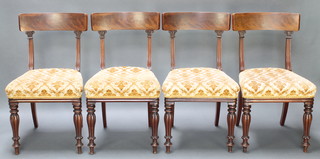 A set of 4 William IV mahogany bar back dining chairs with upholstered seats, raised on turned and fluted supports 