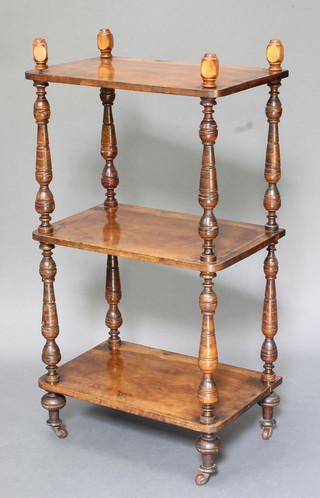 A Victorian walnut 2 tier what-not raised on turned supports 41"h x 21 1/2"w x 13 1/2"d 