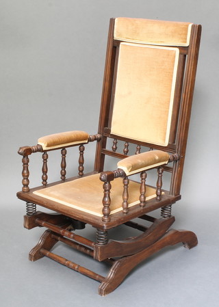 A 19th Century American mahogany rocking armchair