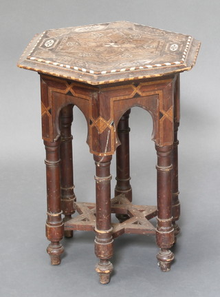 A Moorish octagonal style inlaid ivory occasional table, raised on turned supports the base with Star of David stretcher 19" x 15" x 16" 