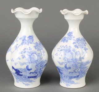 A pair of Chinese fluted oviform vases decorated with flowers and birds, 6 character mark to base 7" 
