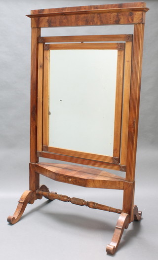 A 19th Century Continental rectangular plate cheval mirror contained in a carved walnut frame with reeded columns to the side, the base fitted a drawer, raised scroll supports with H framed stretcher  78"h x 46"w 