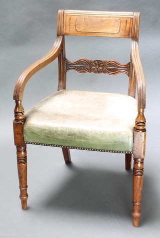 A Georgian mahogany bar back carver chair with carved mid rail and upholstered seat, raised on turned supports