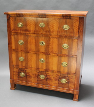 A 19th Century Biedermeier style chest of 4 long drawers with brass handles, raised on square feet 39"h x 36"w x 18"d 