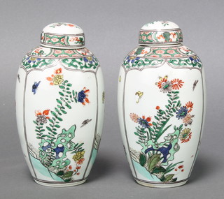 A pair of early 20th Century Chinese famille vert oviform vases decorated with panels of insects and flowers 6" 