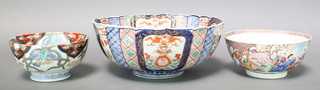 An 18th Century famille rose bowl decorated with figures in pursuits 8", a 19th Century Imari fluted bowl decorated with panels of exotic birds 13" and a late 19th Century Chinese Imari bowl decorated exotic birds bearing a 6 character mark 7" 