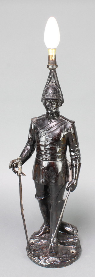 A spelter figure of a standing dismounted life guard, converted to a table lamp 19"h 
