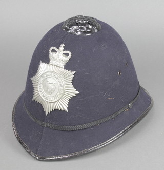 An Elizabeth II Leicestershire and Rutland Constabulary police helmet complete with helmet plate