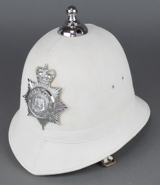 An Elizabeth II Brighton police motorcyclists white helmet complete with helmet plate
