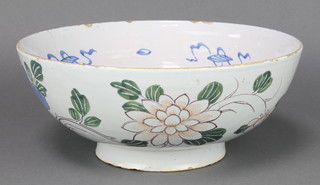 A 19th Century Delft bowl polychrome decorated with stylised flowers 10" 