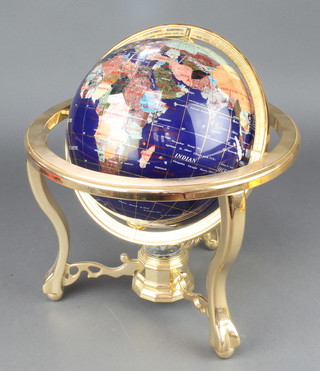 A Franklin Mint polished "hardstone" terrestrial globe raised on a gilt metal stand 