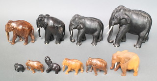 Ten various wooden model elephants