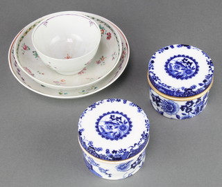 A pair of Copeland cylindrical blue and white boxes and covers decorated with flowers 2 3/4", 2 18th Century English saucers and a ditto tea bowl 