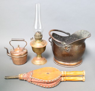 A 19th Century copper kettle 5", a copper helmet shaped coal scuttle, a pair of elm bellows and a gilt metal oil lamp with clear glass chimney 