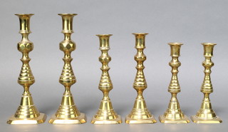 A pair of 19th Century brass candlesticks with knopped stems 10", 2 matched pairs of 19th Century brass candlesticks 8" and 7" 