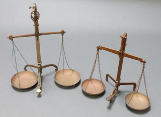 A pair of brass class B bank scales and 1 other pair of bank scales (chains f)