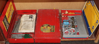 A metal box containing an Erector Kit together with 2 other metal boxes containing Erector Kits 