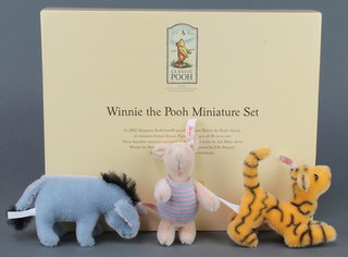 A Steiff limited edition Winnie The Pooh miniature set with Eeyore, Piglet and Tigger, boxed and with certificate 123/5000