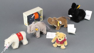 A Steiff figure of Winnie the pooh 680113, 02281,  5", complete with certificate, ditto polar bear 037375 5", black rabbit 080067 5", hippopotamus 041143 5", elephant 040498 4" and a blue elephant club gift 