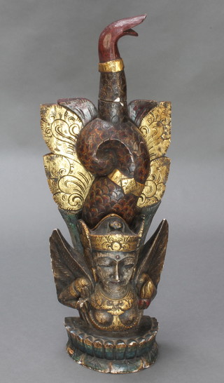 A carved Eastern figure of a winged deity 33"h